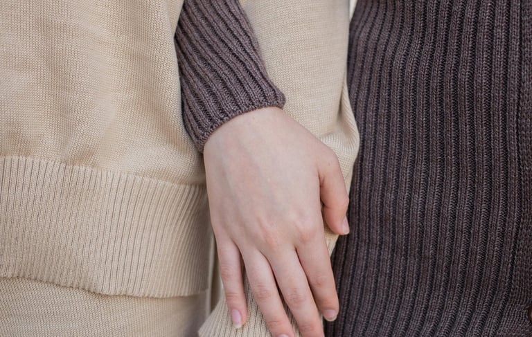 a man and woman holding hands and holding hands