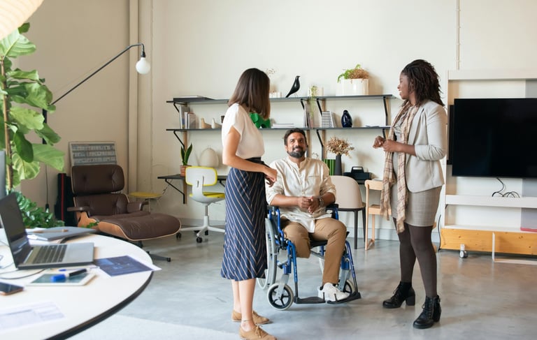 a man and woman in wheelchairs in a room