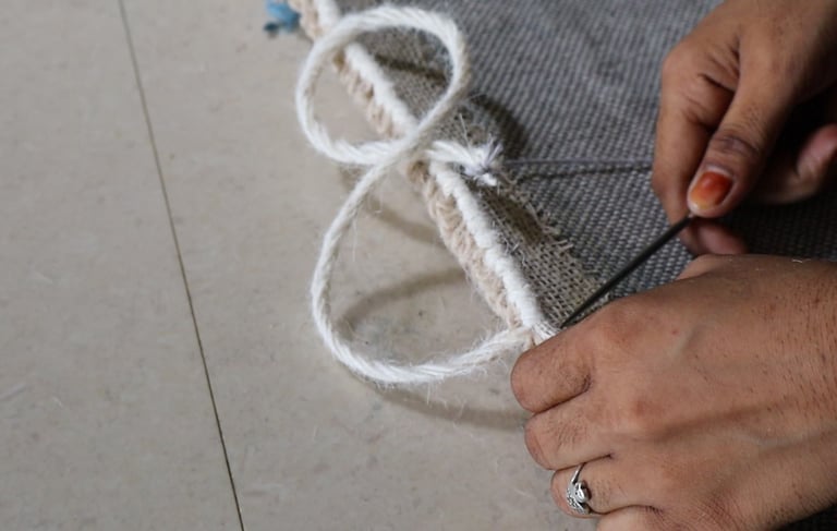 Carpet edge finishing and binding process