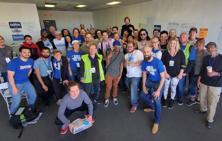 Ray Jarosz poses with is Bernie Sanders 2020 team.