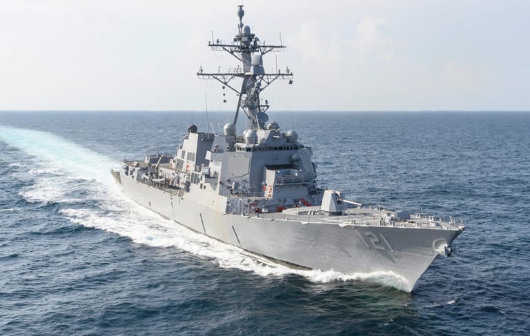 a large Navy ship in the water