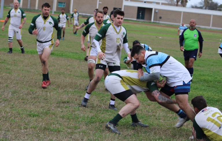a rugby player is trying to get the ball away from the opposing teams