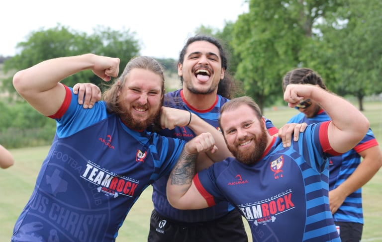 a group of men in blue and red uniforms posing for a photo