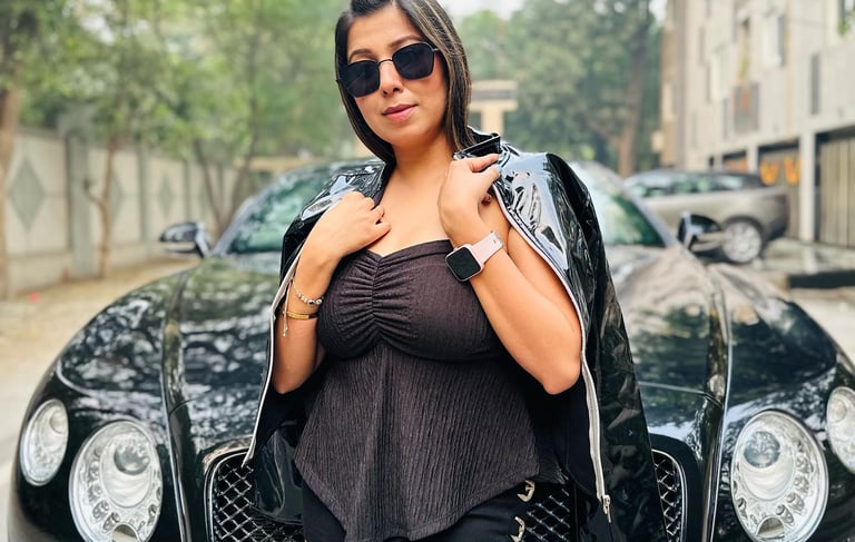 a woman in black shorts and boots is posing for a picture