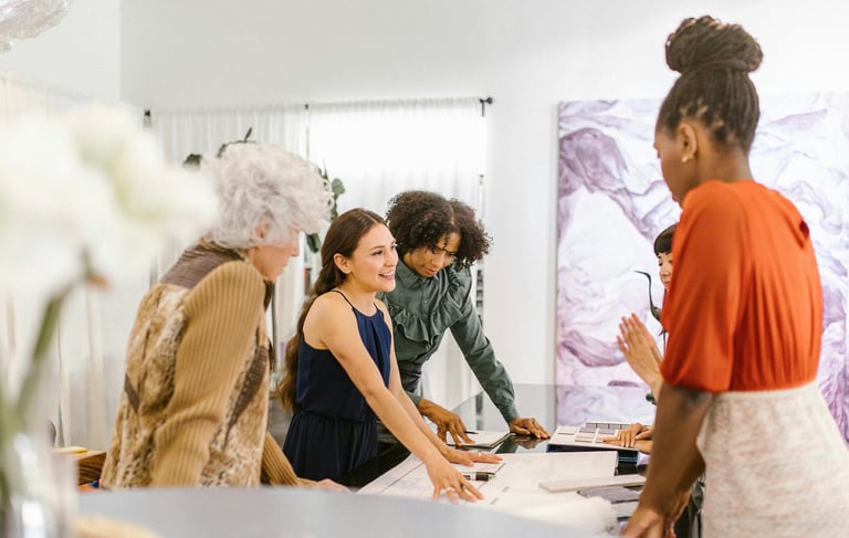 Team discussing ideas around a table in a meeting room