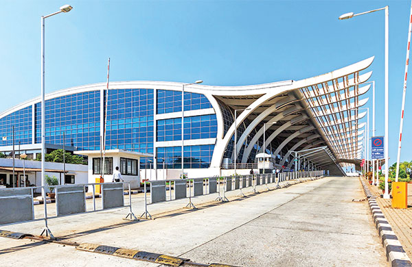 a large building with a long walkway at goa airport goi