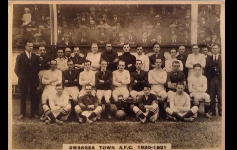 Vintage black and white team photo of Swansea Town A.F.C. football players from the 1920-1921 season.