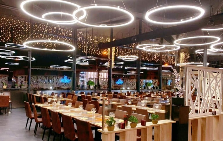 a restaurant with a long table and chairs