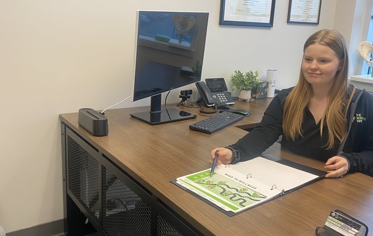 Dr. Destiny reviewing labs with a patient in her office