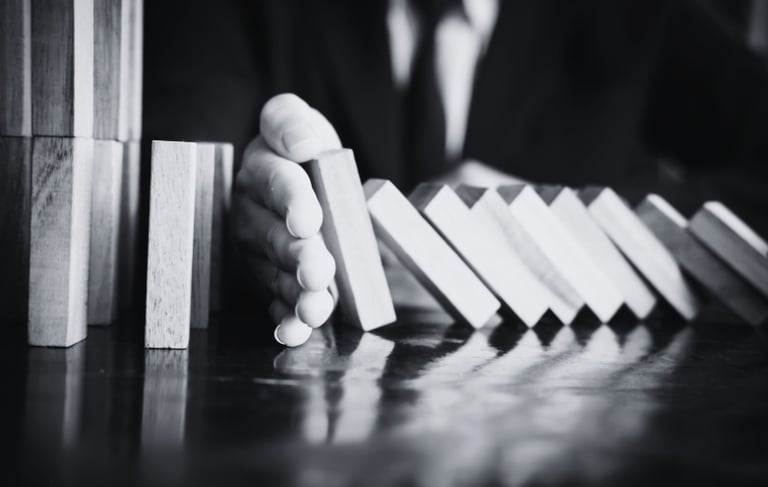 a man in a suit and tie is playing domino board game