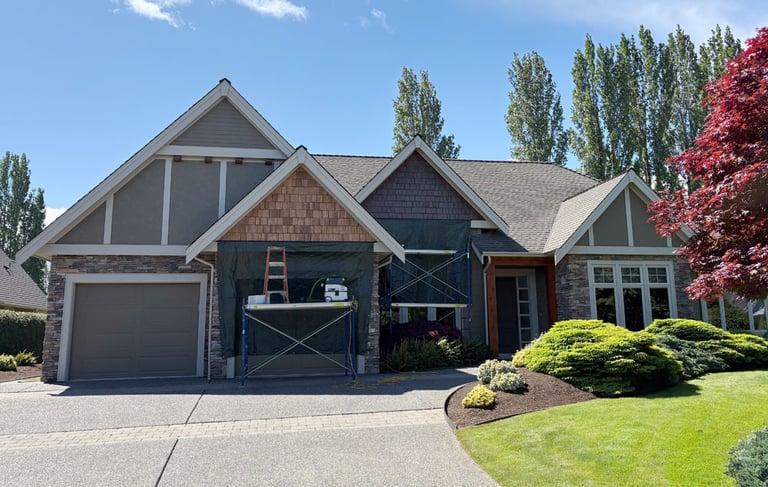 home partway through cedar shingle revitalization project in Qualicum Beach
