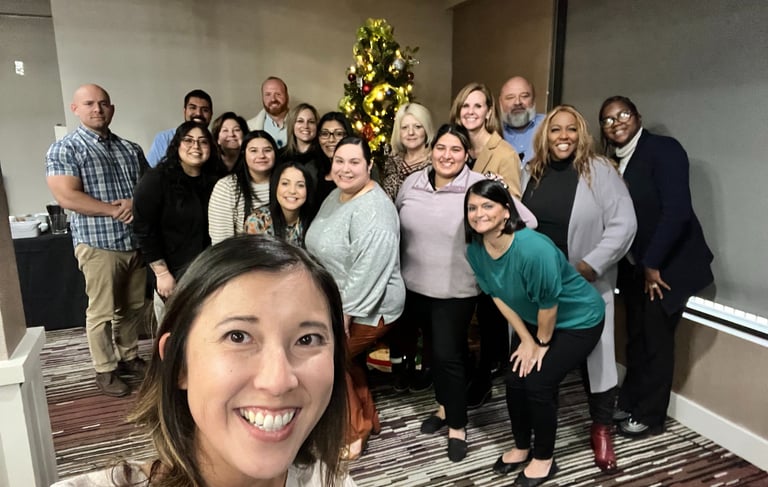 Unleashing Radiance team smiling together at a event.