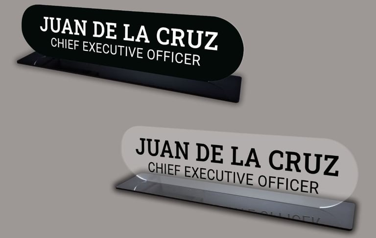 2 desk name plates with black and clear acrylic with the name Juan Del La Cruz