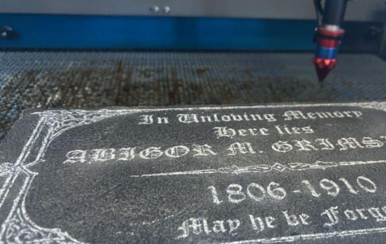 Granite engraved with text using a laser cutter