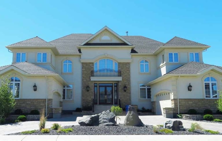 a large house with a large front yard and a large front yard