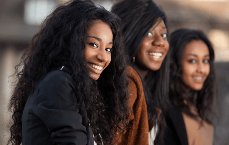 Smiling faces of diversity in the energizeHER Village for Girls membership