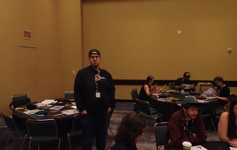 Jacob stands watch over the tables.
