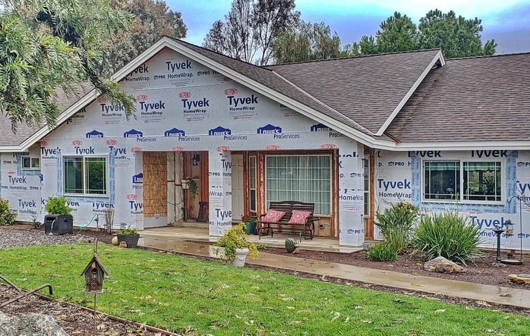 Ranch style home with Tyvek housewarp and new windows.
