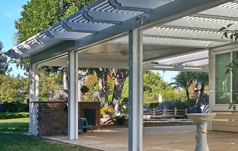 White custom Alumawood shade cover with solid mitered corner and open lattice side sections. 