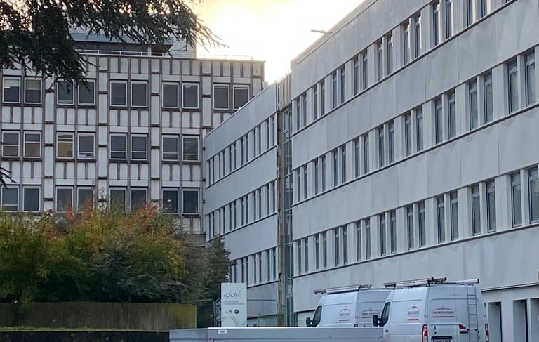 a microwave oven and refrigerator in front of a building