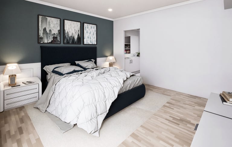 Modern bedroom with a teal accent wall, tan tufted headboard, white dressers, and light wood flooring.