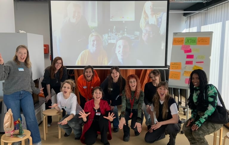 Group of women posing together after a workshop, smiling and appearing confident.