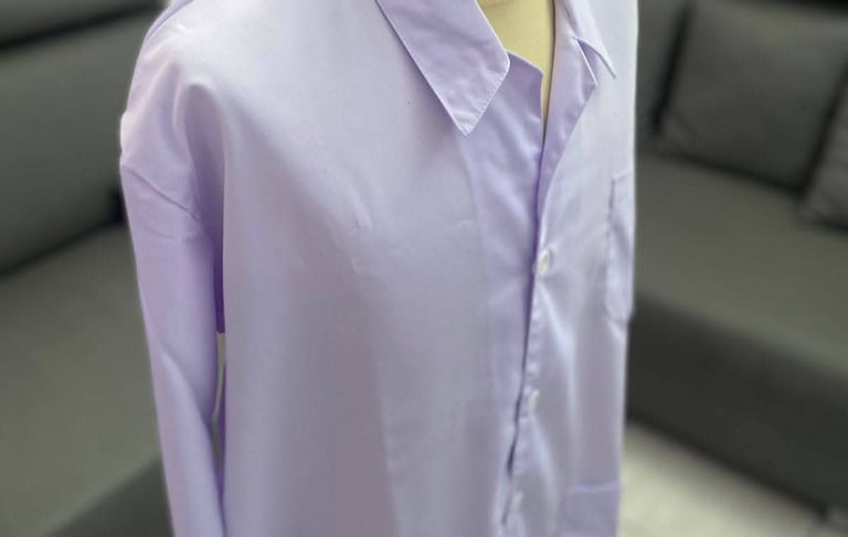 A white long-sleeved lab coat with the Institut Teknologi Bandung ITB logo on the pocket.