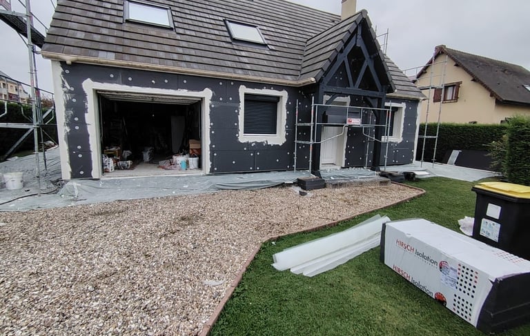 a house with a garage door and a garage door