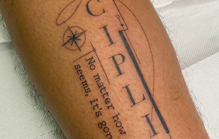 a tattoo on a man's leg with a tattoo of a guitar