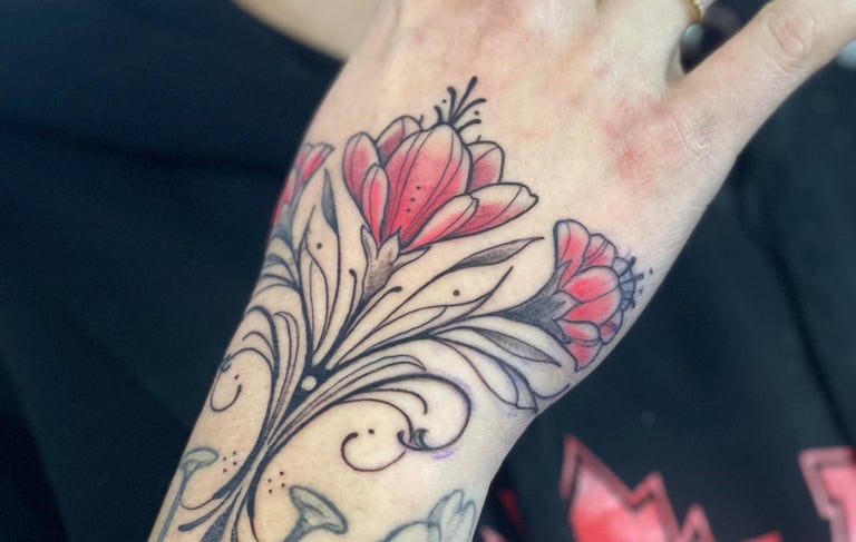 Ornamental flower Tattoo in the woman’s hand. 