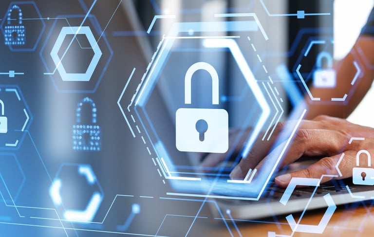 Professional person typing on a laptop with digital cybersecurity padlock icons and data protection overlays.