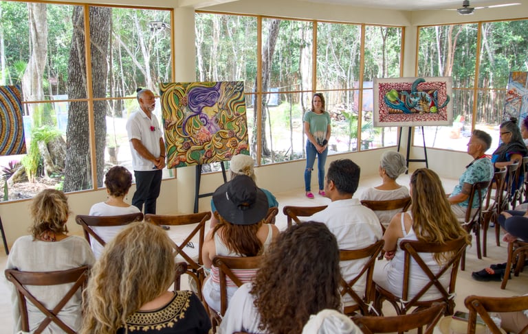 Artist Ismael Venegas presents Conscious Art therapy, colorful abstract paintings to an audience in