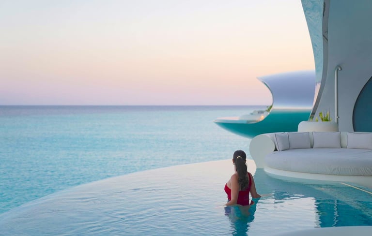 shebara-resort-overwater-villa-pool-sunset-model