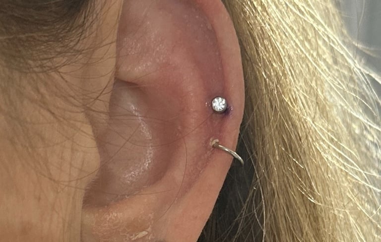 Fresh helix piercing fitted with safe titanium stud jewellery