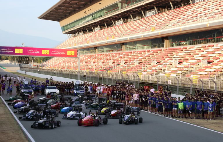 a group of motorcyclists on a race track