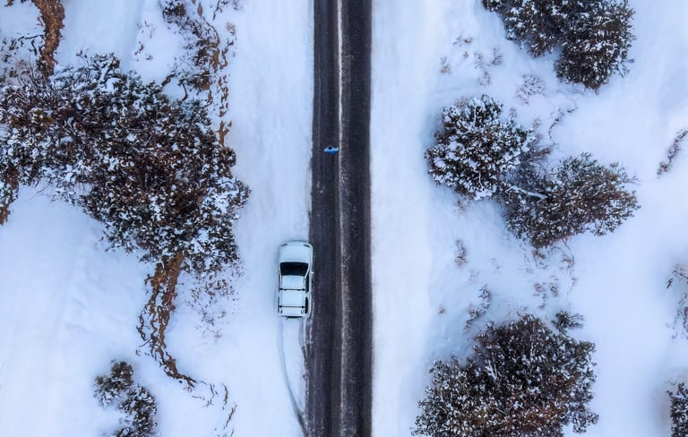 a car driving down a snowy road. arbab naimat kasi , balochistan , ziarat , award