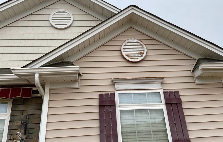 House with two round decorative circles before they were painted.