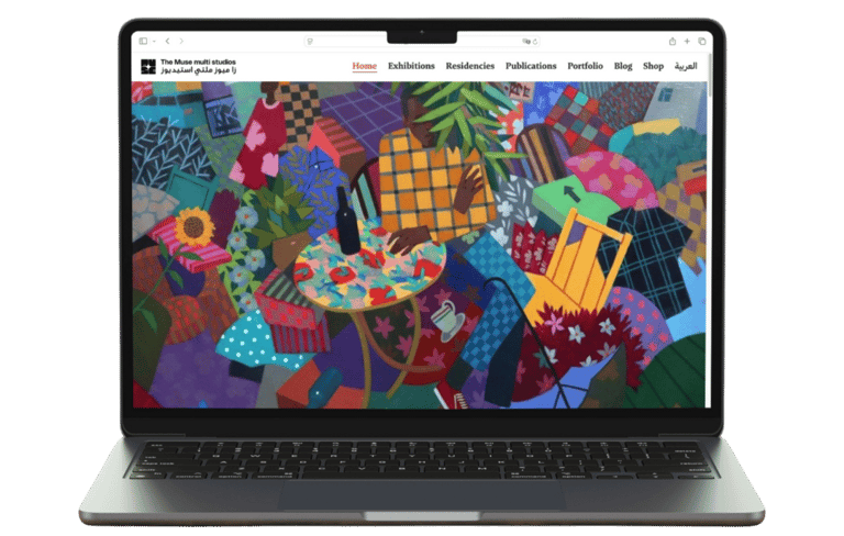 a laptop computer screen displaying a picture of a colorful painting as the hero section