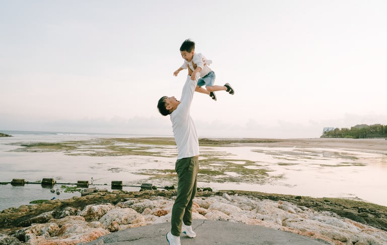 Family portrait on the jetty during a luxury family photography session at The Apurva Kempinski Bali.