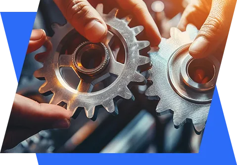 two hands holding gears and gears on a blue background