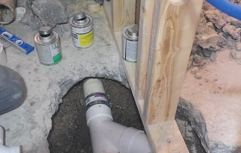 rough installation of plumbing pipes during a bathroom remodeling project