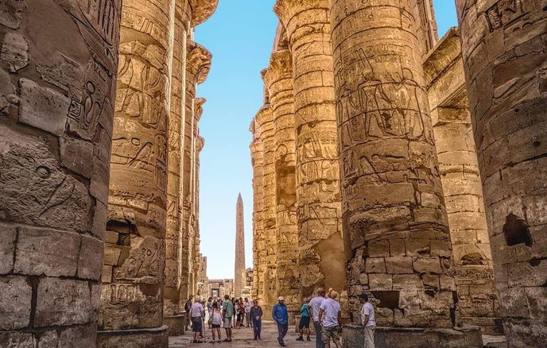 a group of people walking through a narrow alley