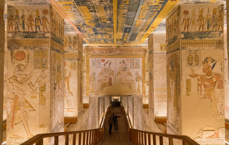 a person walking down a long hallway with a large ceiling