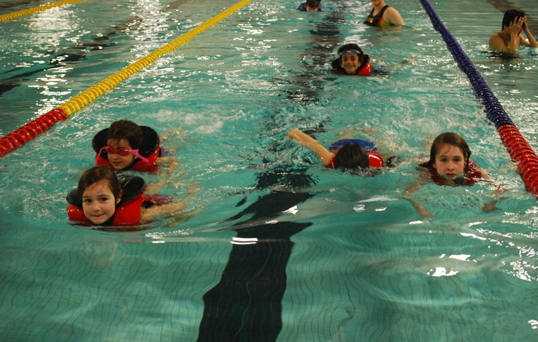 kids swimming in lifejackets