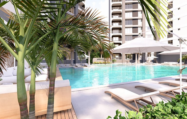 Relaxing outdoor swimming pool with sun loungers at Aperito Tower Clark