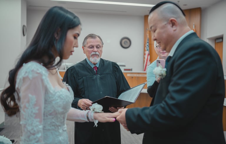 a man and woman getting married in a courtroom
