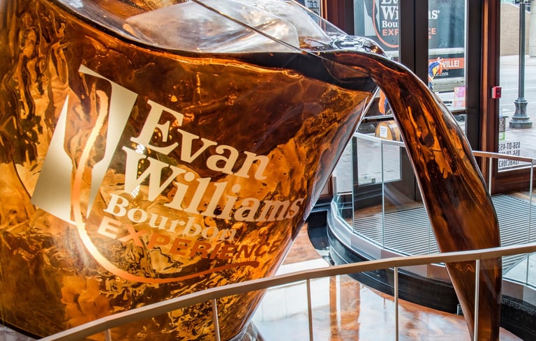 a Fountain of Bourbon being poured into a glass of wine