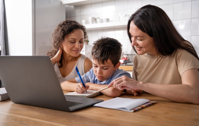 a woman and a child are sitting at a table