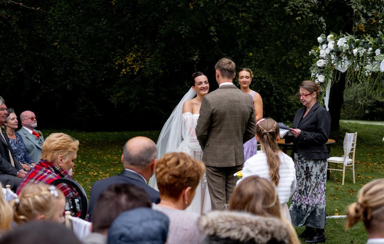 a man and woman getting married in a wedding ceremony