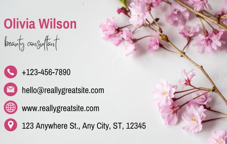 a business card with a pink flower on it